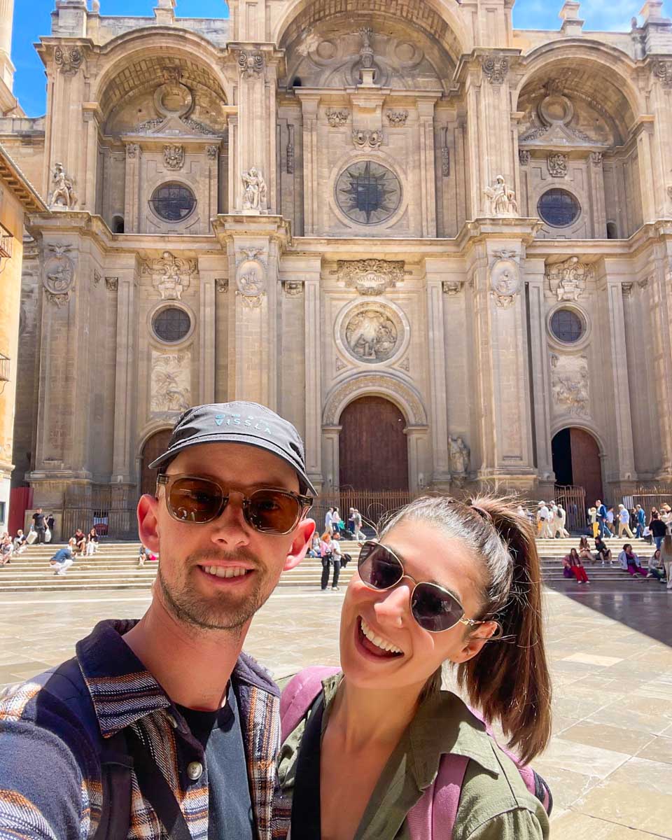 Brittni and Jesse take a selfie in front of the Granada Cathedral