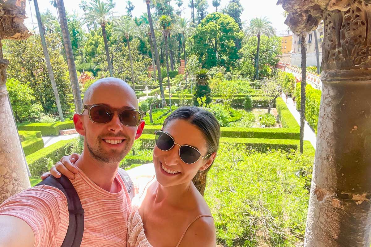 Brittni and Jesse take a selfie overlooking the gardens at the Royal Alcazar of Seville