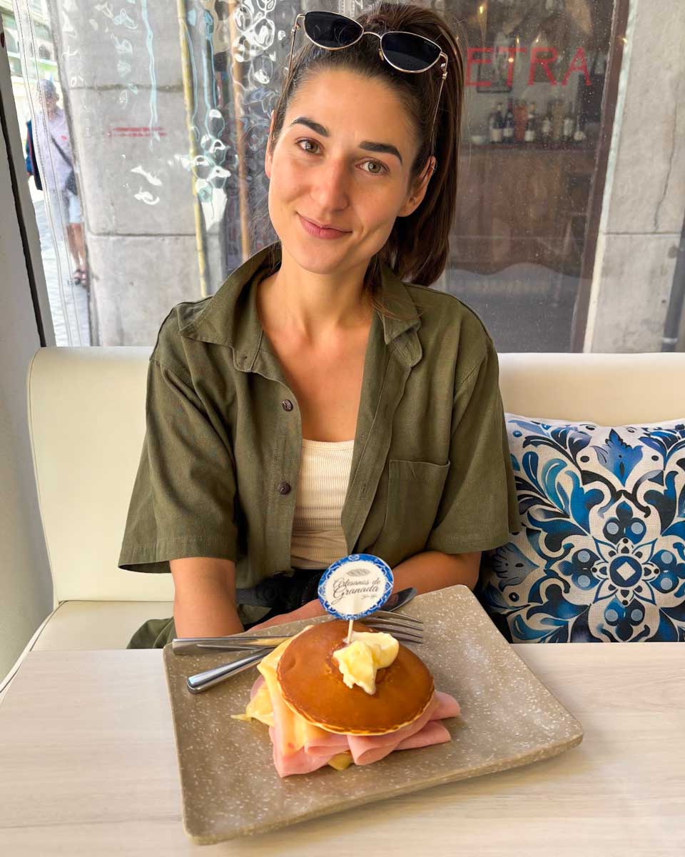 Brittni eats a savoury pancake for breakfast at Artesanos de Granada