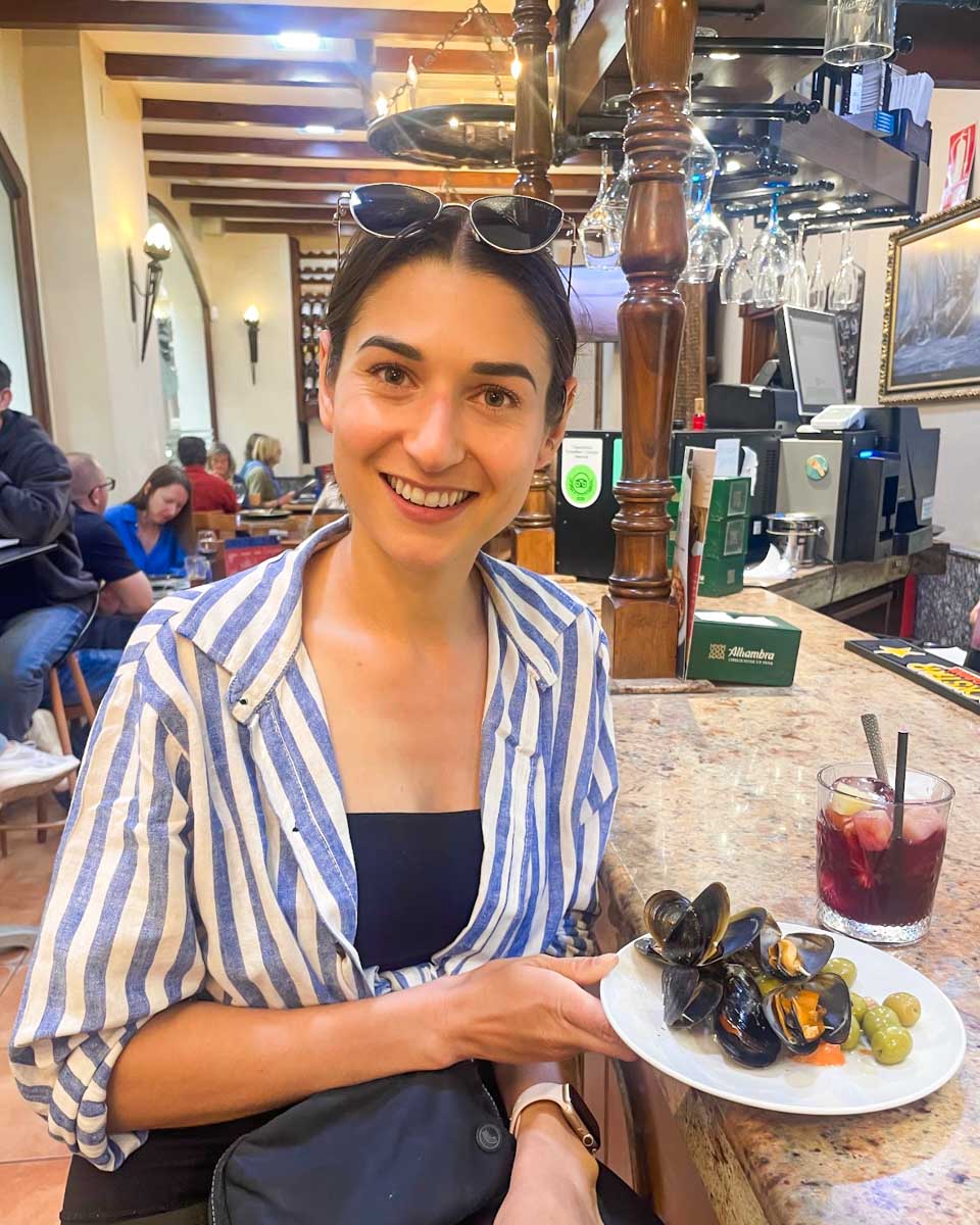 Brittni has a drink and tapas at El Fogón de Galicia in Granada