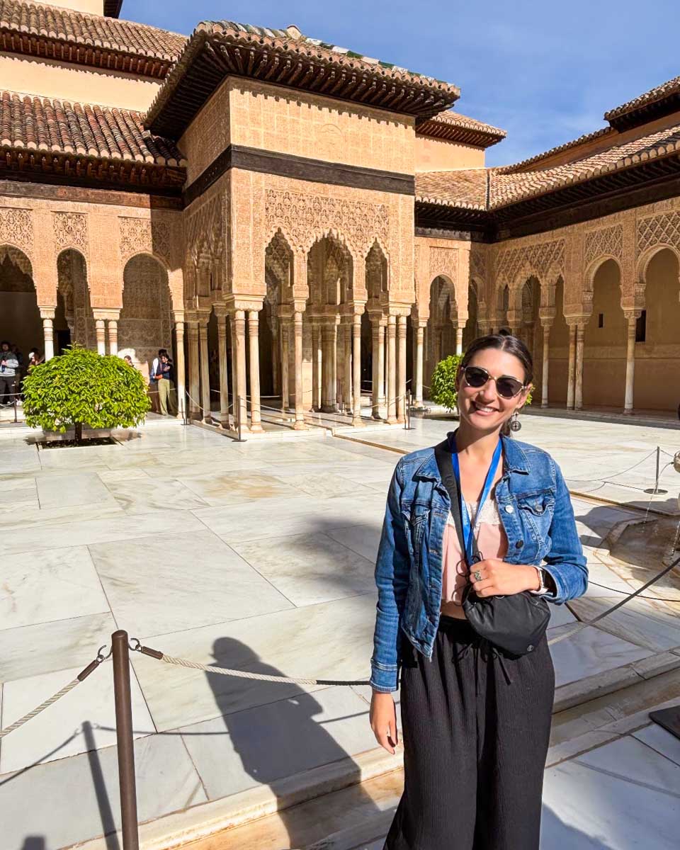 Brittni poses at the Nasrid Palaces of the Alhambra in Granada