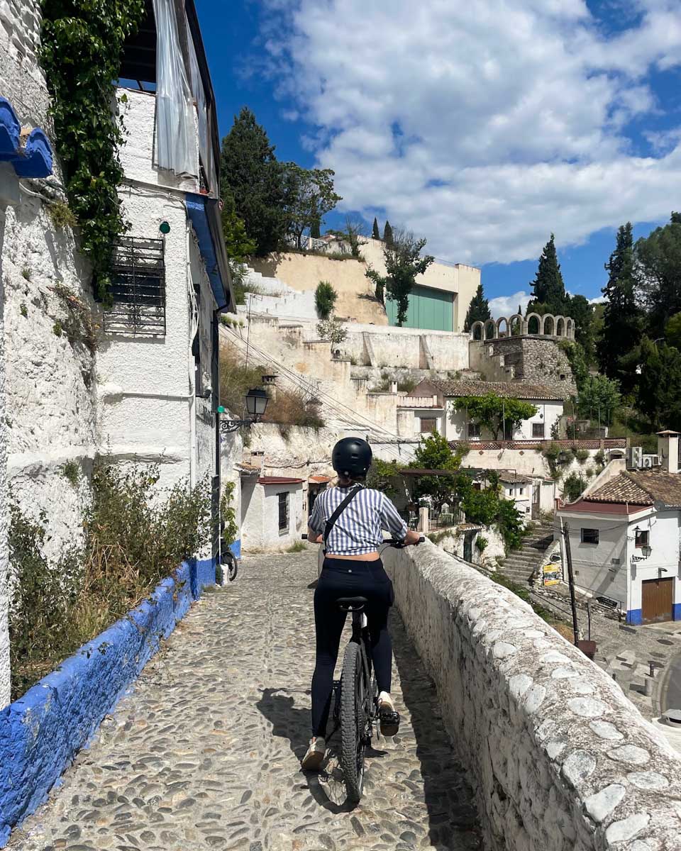 Brittni rides through Sacromonte on an e-bike tour in Granada