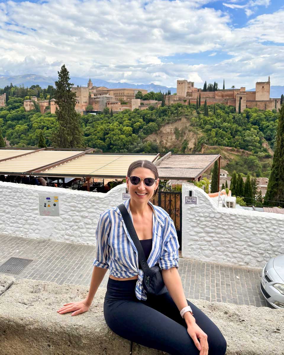 Brittni with the Alhambra in the background at Mirador de San Nicolás in Granada