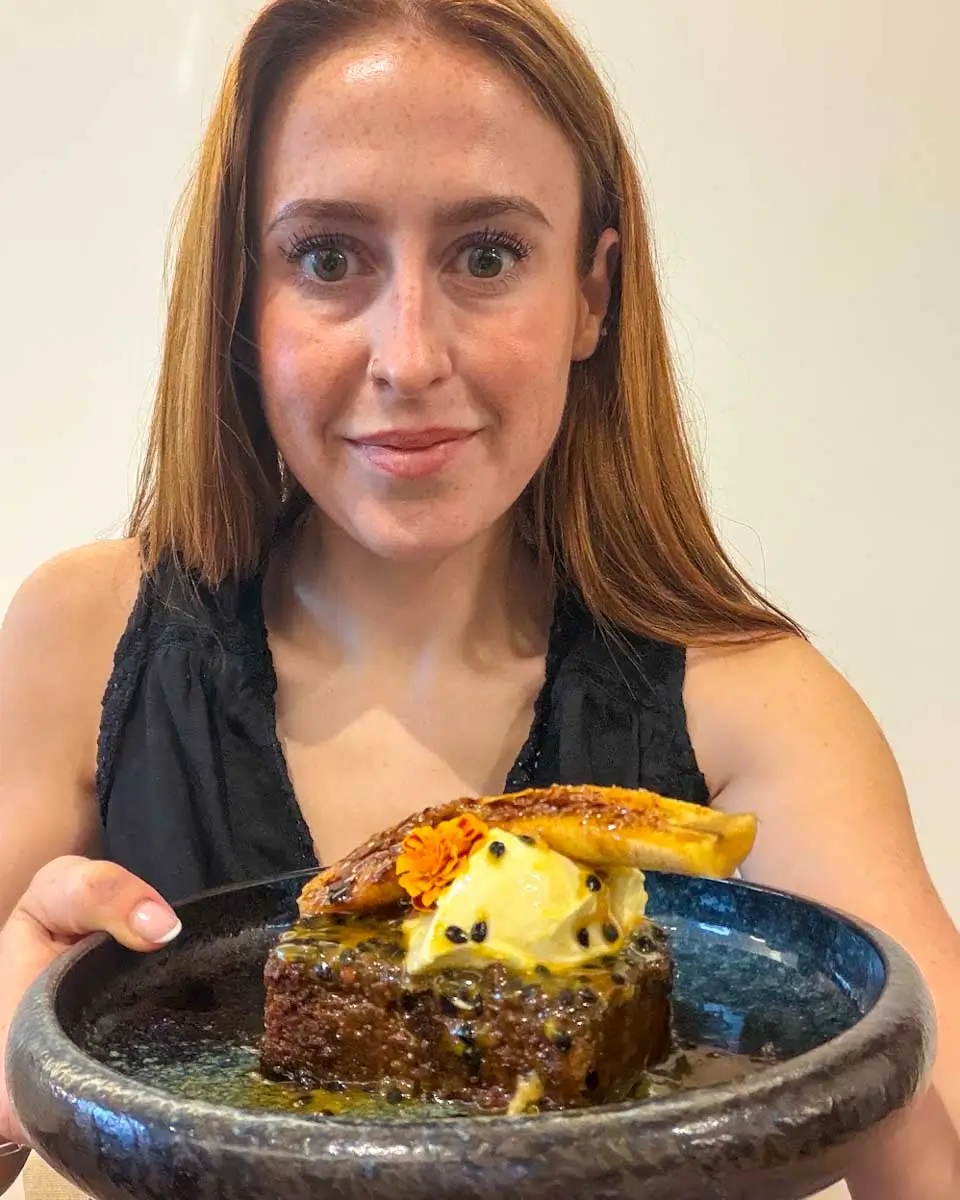 Hannah having banana bread french toast at Rise and Dine, Madeira, Portugal