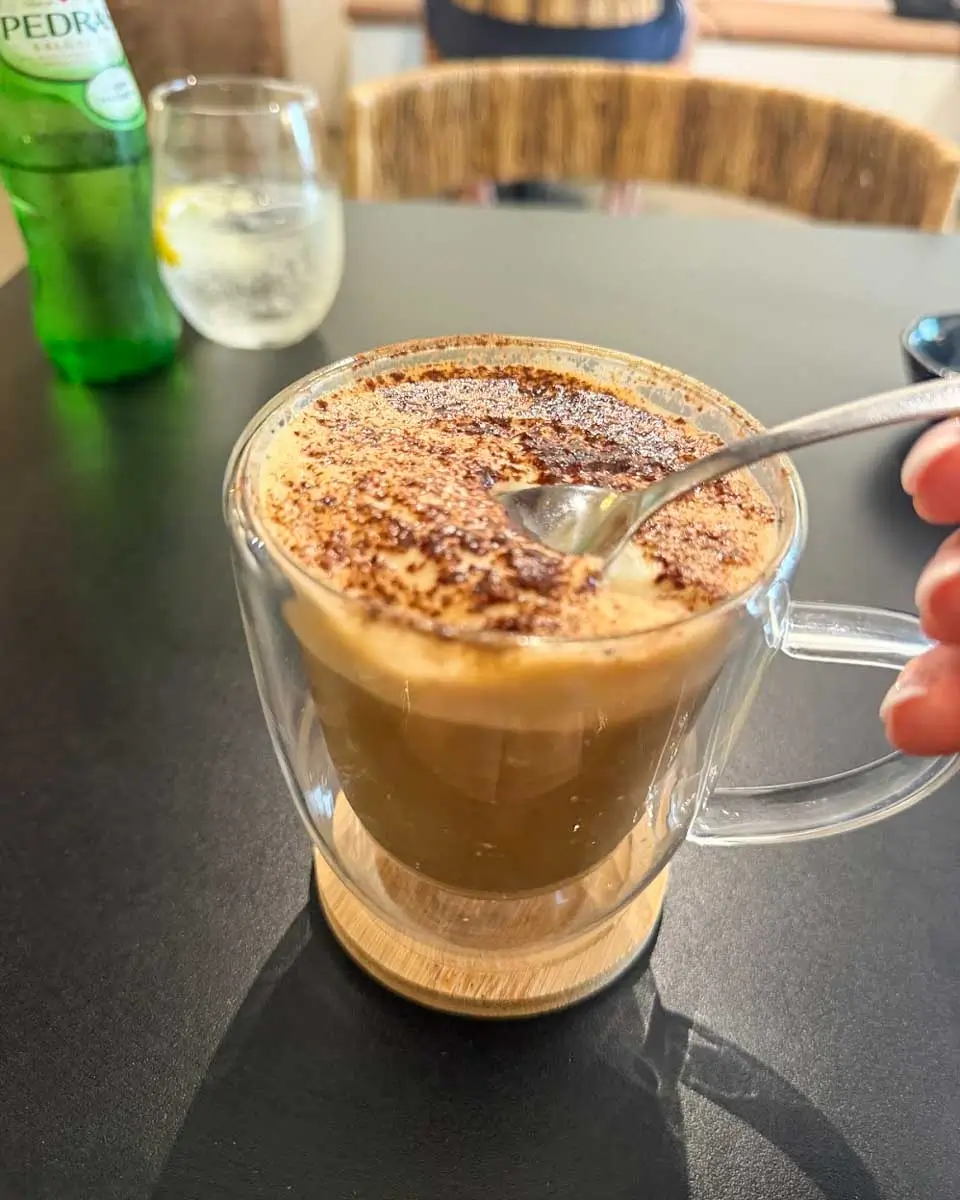 Hannah having coffee in Rise and Dine, Madeira, Portugal