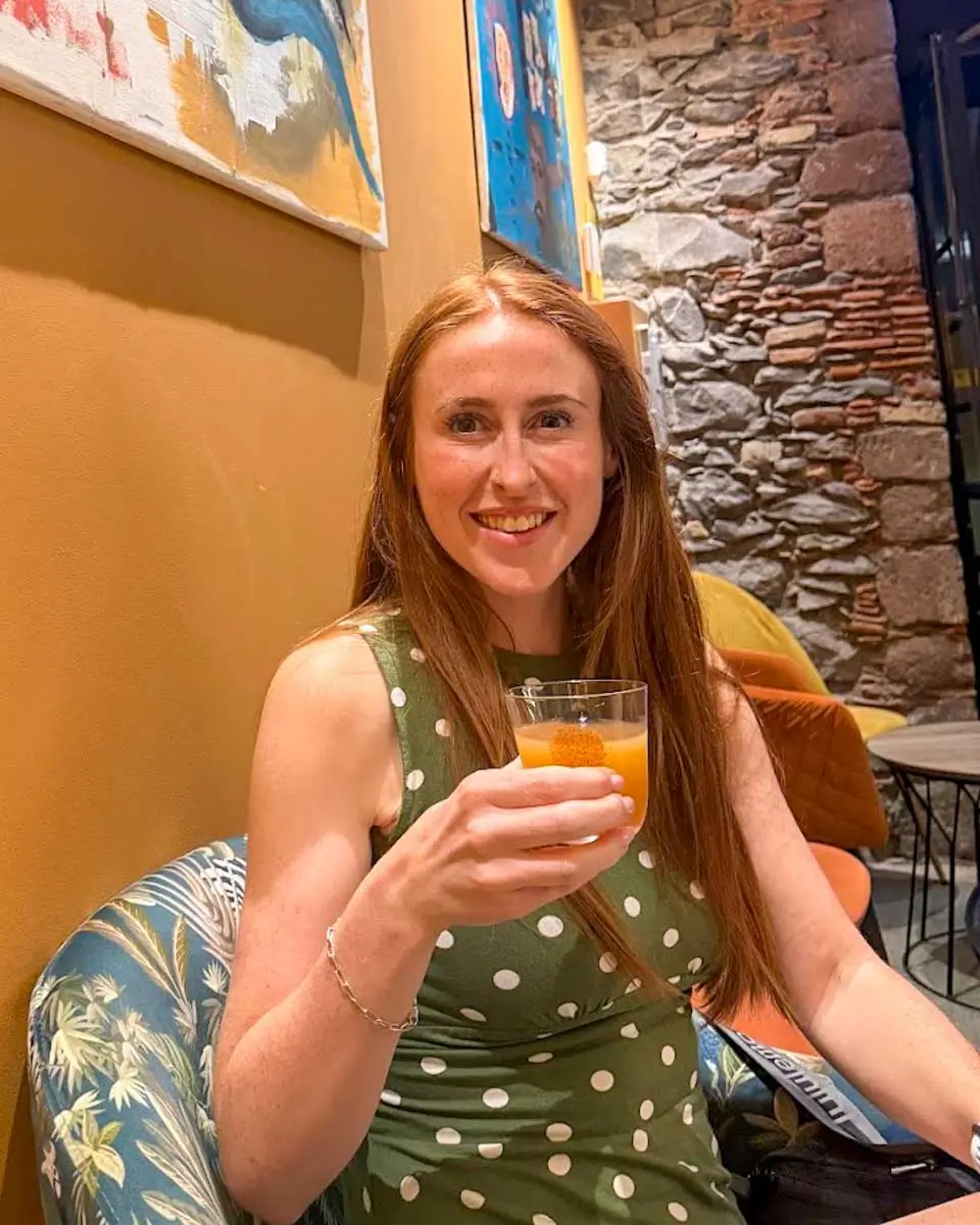 Hannah having drink at Restaurante Informal in Madeira, Portugal