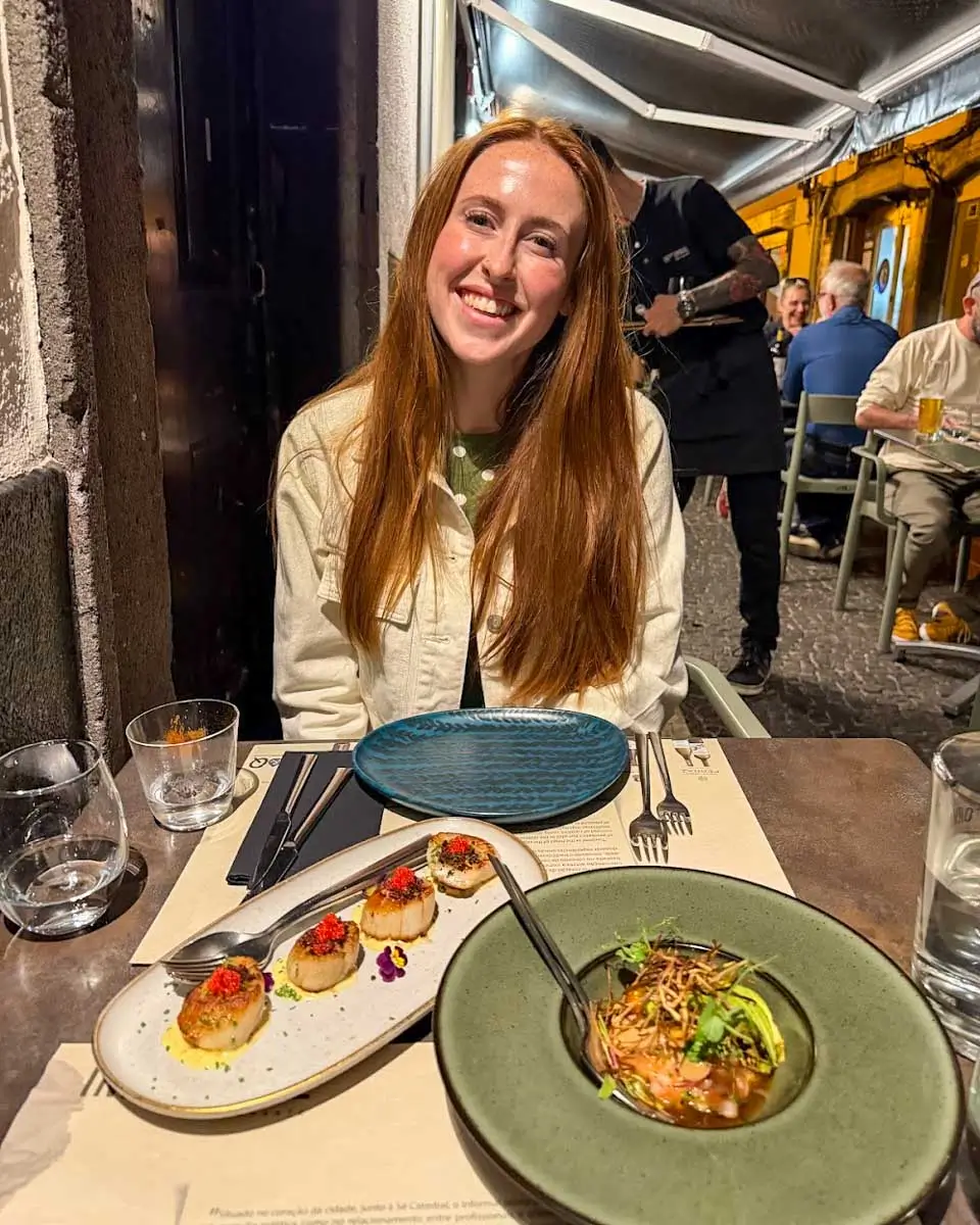 Hannah having food at Restaurante Informal in Madeira, Portugal
