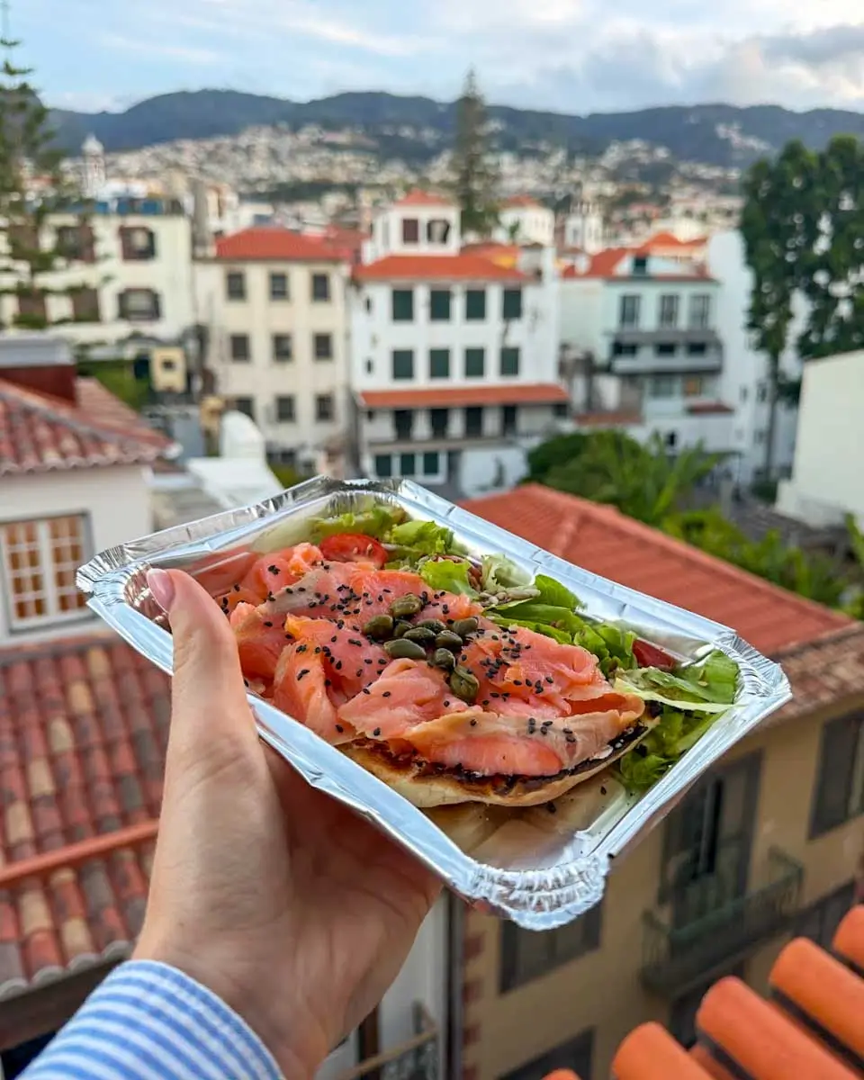 Hannah having smoked salmon on toast from Studio Coffee and Brunch, Madeira, Portugal