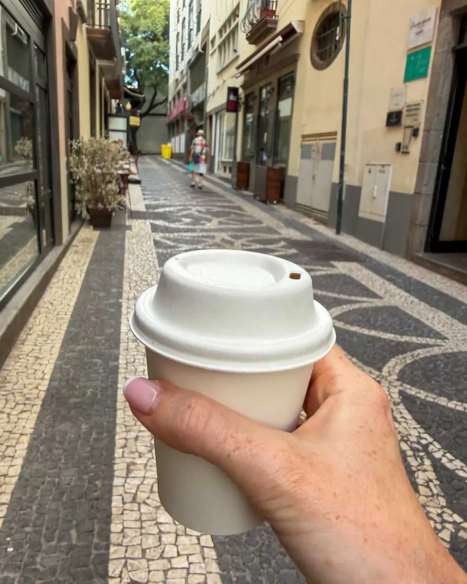 Hannah holding coffee from Vera Cruz, Madeira, Portugal