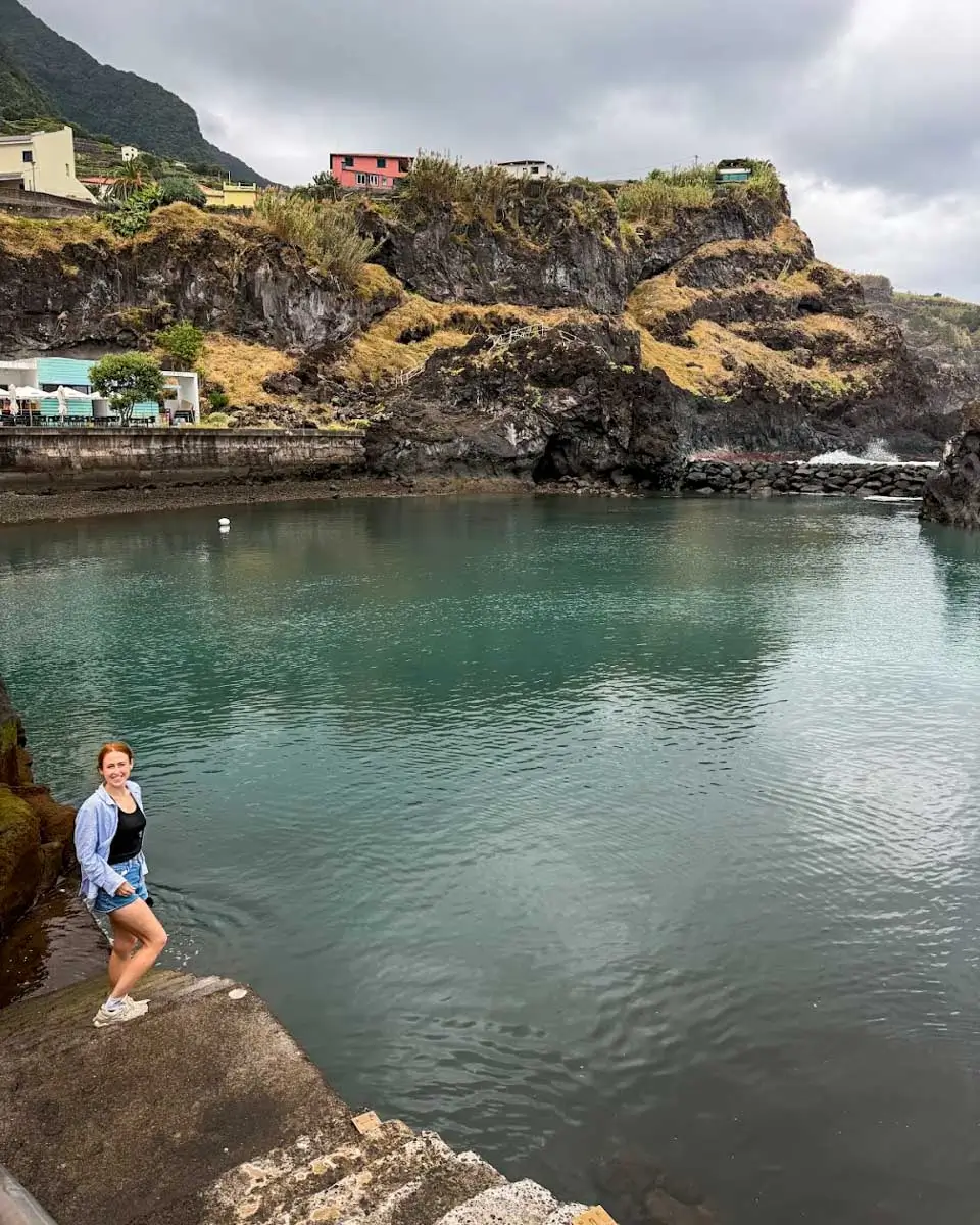 Hannah takes photo by the pool in Madeira, Portugal