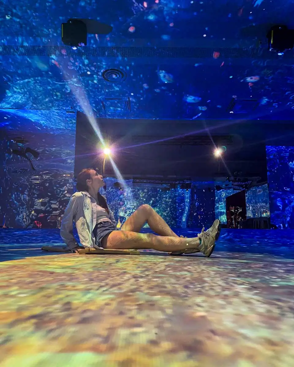 Hannah taking photo inside the Immersive Mm of Madeira (IMOM), Portugal