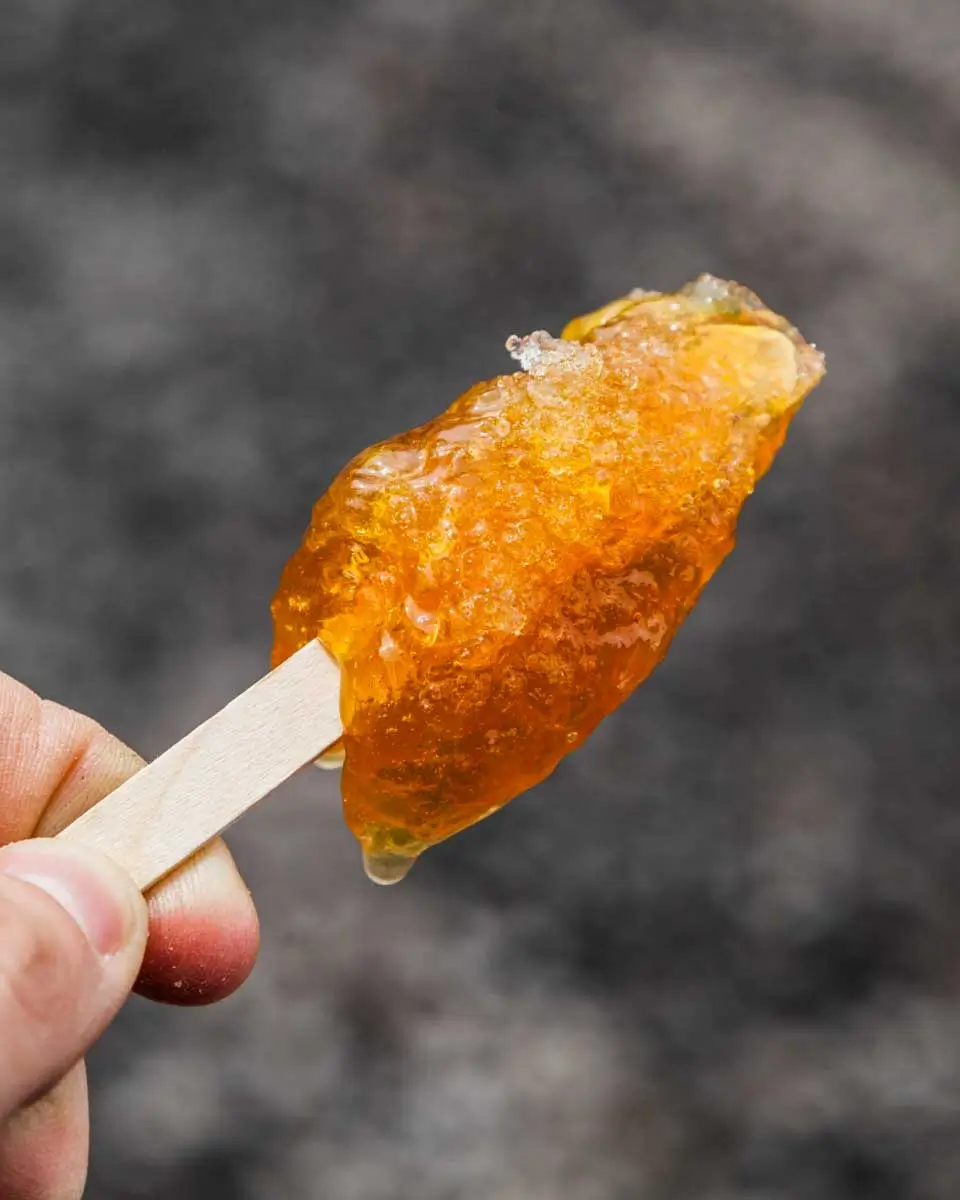 Maple taffy on a stick eaten on a food tour in Quebec City, Canada