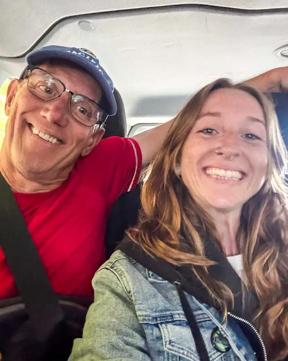 Meghan and her dad in a van on the way to Multnomah Falls, Portland, Oregon
