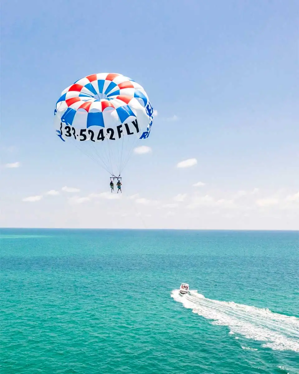 People parasailing over Anna Maria Island, Sarasota, Florida