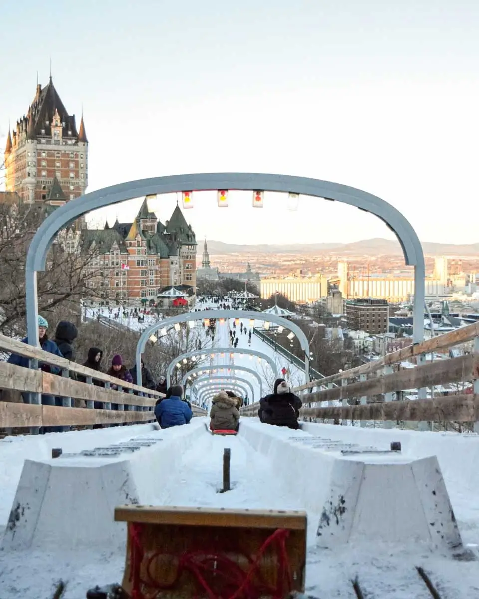 People riding down the toboggan Slide in Old Quebec city, Canada