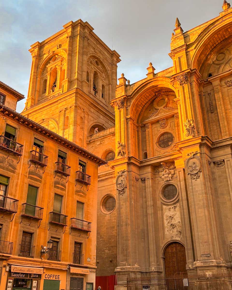 The Granada Cathedral lit up at sunset