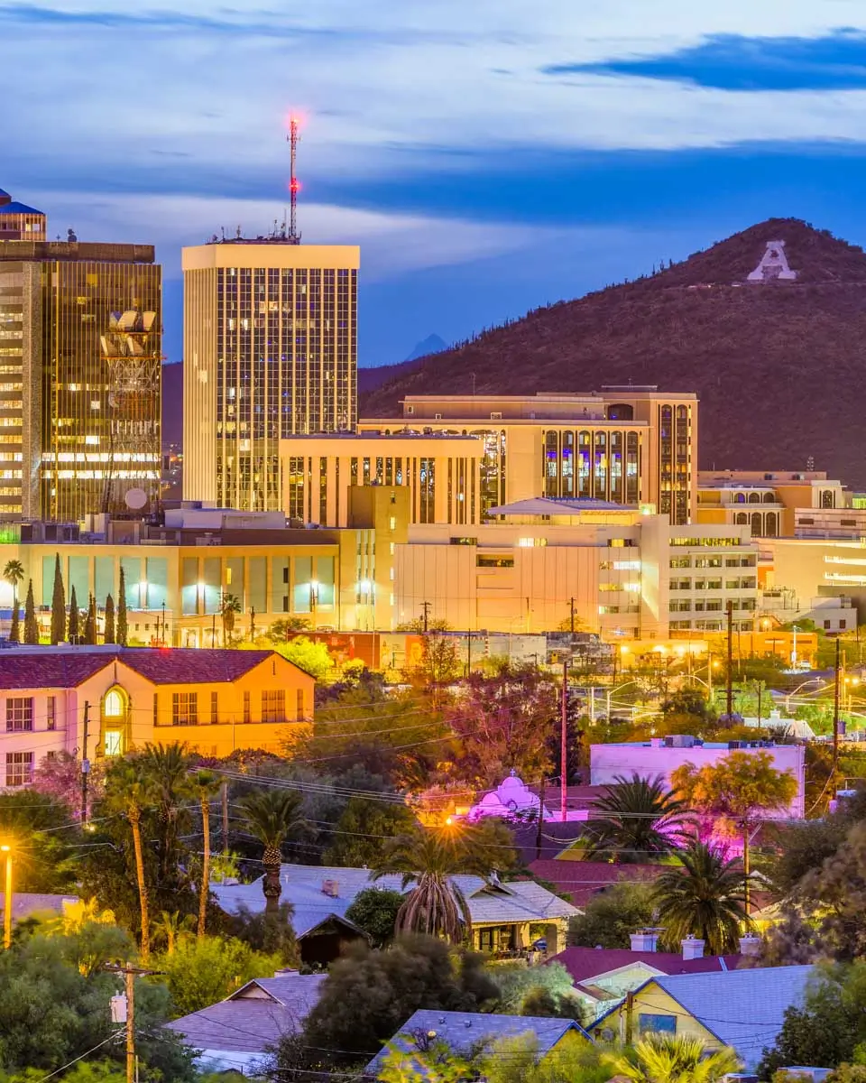 Tucson, Arizona, USA downtown skyline with Sentinel Peak at dusk