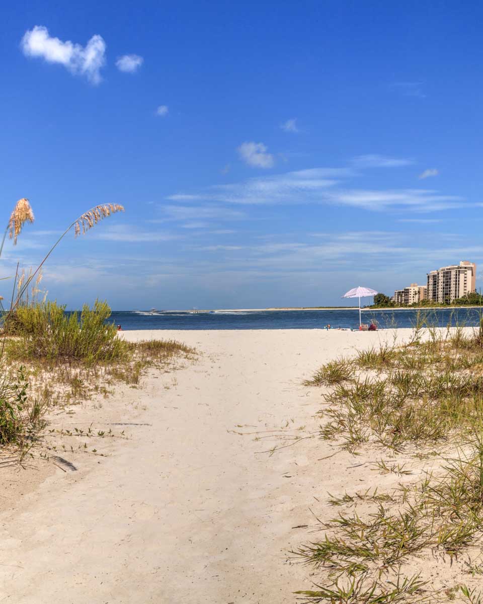 White sand beach path leading to the ocean at Lovers Key Beach